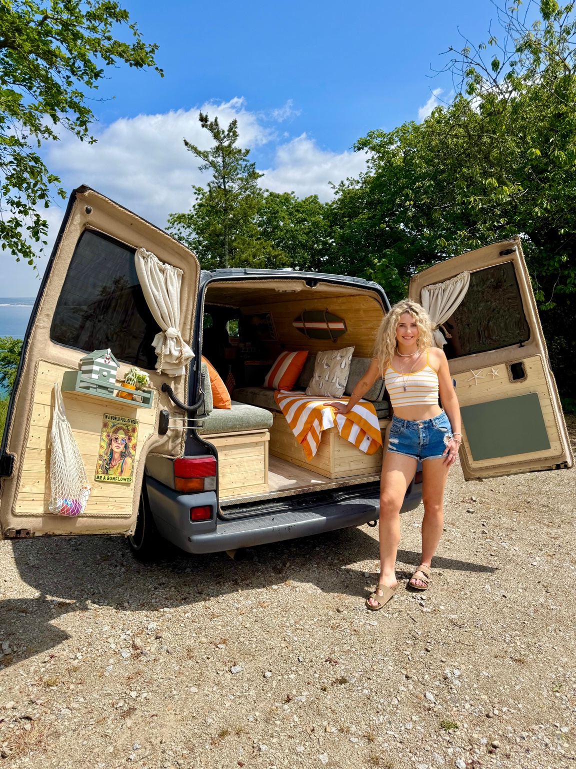Lana beside the finished interior of the original Storky campervan